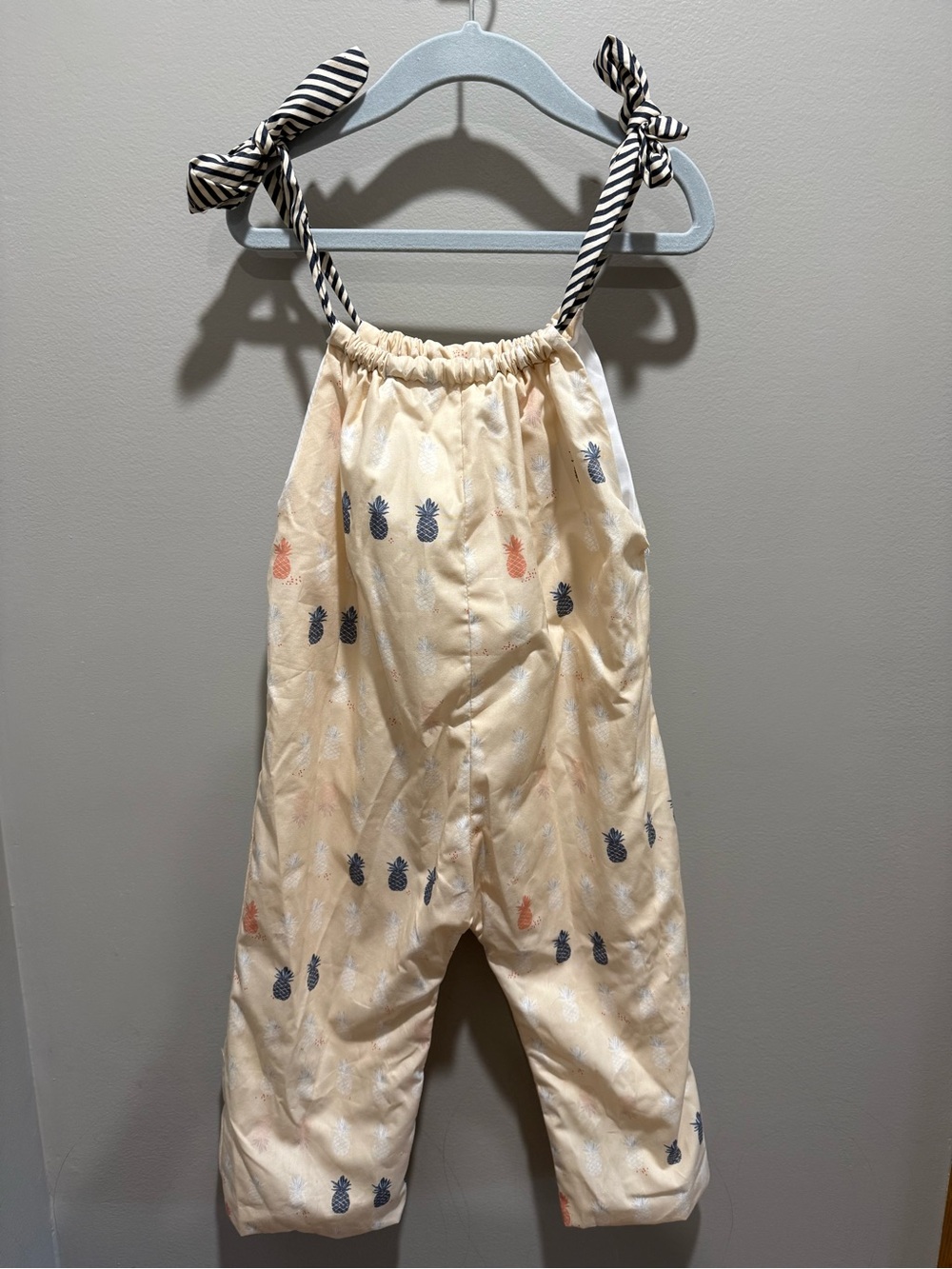 Charleston City Market vendor 
Girls' Cream Pineapple Tie-Shoulder Pajama Romper